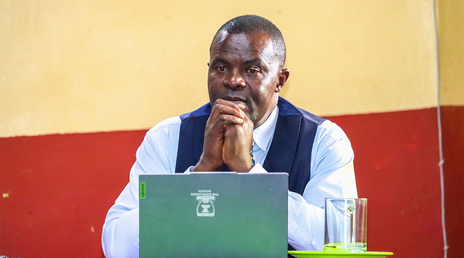 Chairing the AGM session · The Excellence School — UASA SACCO AGM, 20th July 2026